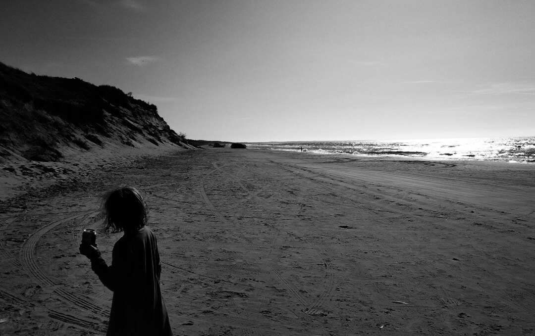 Portrait of a Danish female documentary photographer holding a camera